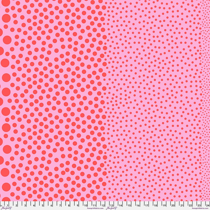 Stones Watermelon by Tula Pink, coral-red dots in varying sizes on a pink background.